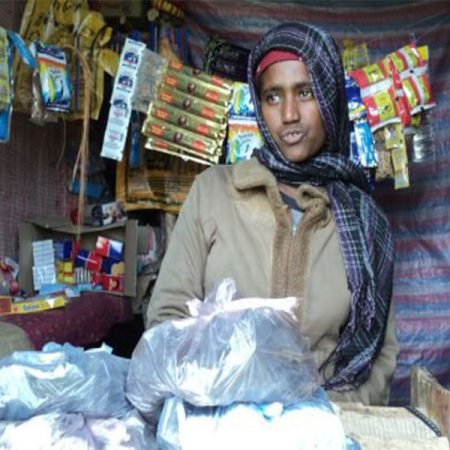 Image showing a woman in her shop HPD-O’s assistance to a disabled persons
